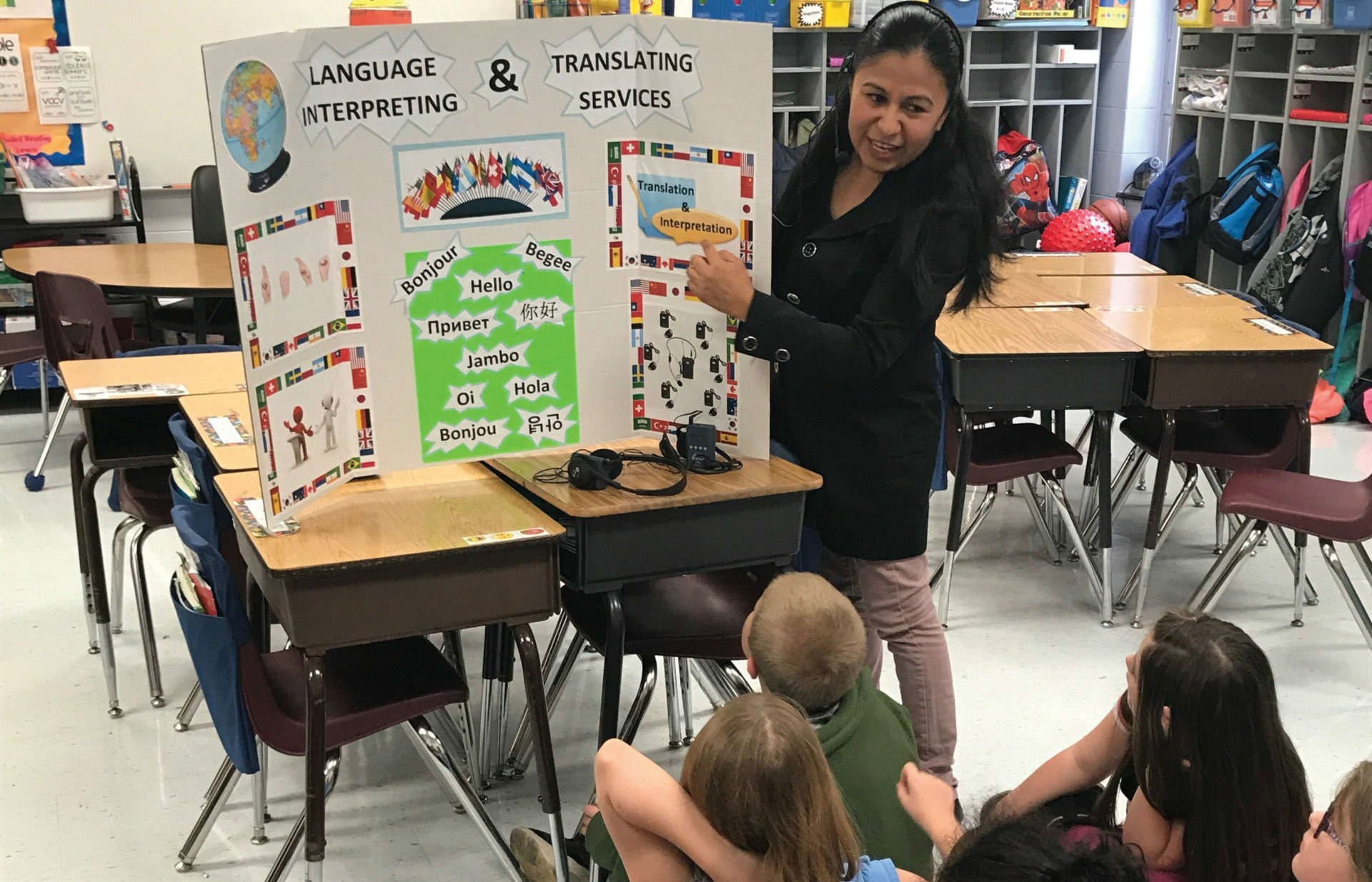 Jessica Sanchez explains the difference between translation and interpreting to students at Harrison Elementary School’s Career Day in Lexington, Kentucky.
