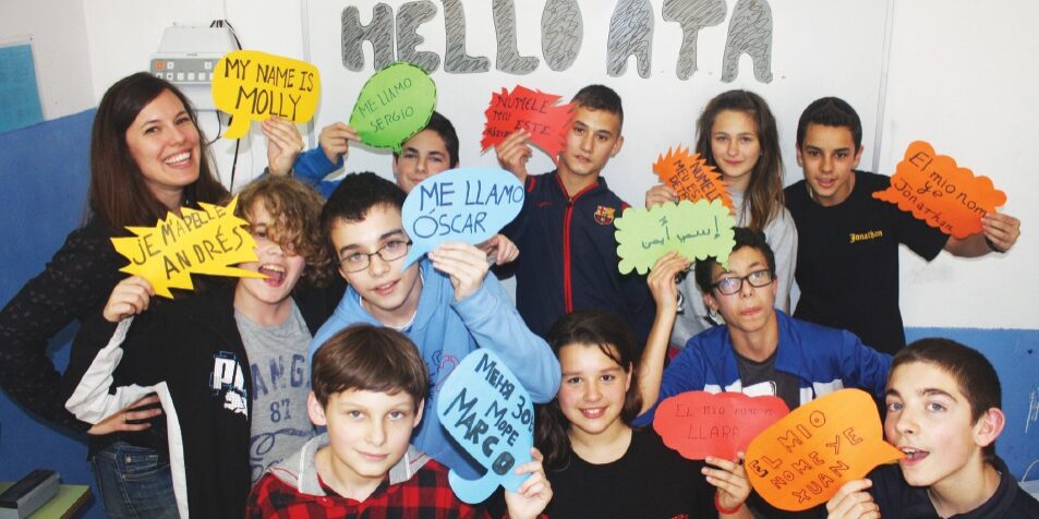 Molly Yurick (left) with students at the Instituto de Educación Secundaria Cuenca del Nalón in Asturias, Spain.