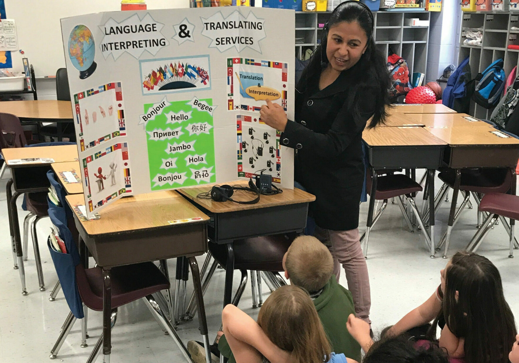 Jessica Sanchez explains the difference between translation and interpreting to students at Harrison Elementary School’s Career Day in Lexington, Kentucky.
