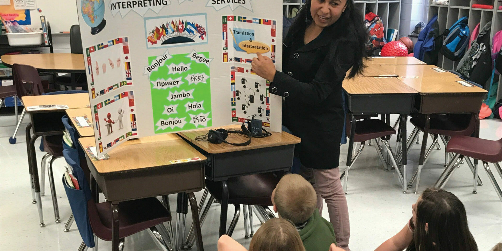 Jessica Sanchez explains the difference between translation and interpreting to students at Harrison Elementary School’s Career Day in Lexington, Kentucky.
