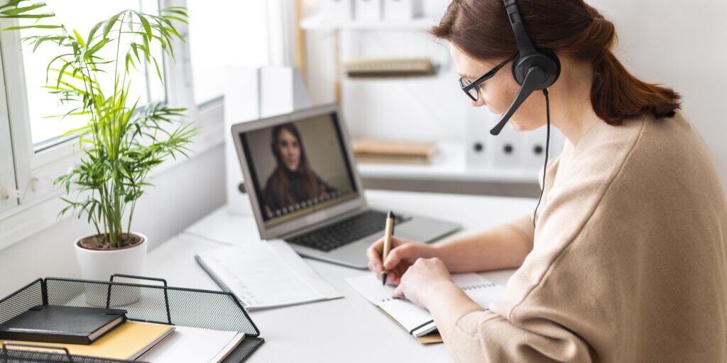 portrait-woman-work-having-video-call-laptop
